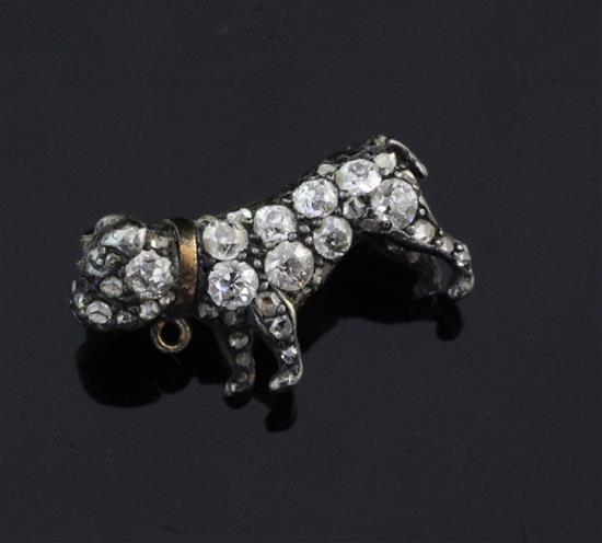 A small Victorian gold and silver, rose cut diamond and cabochon ruby set pug dog brooch, 0.75in.